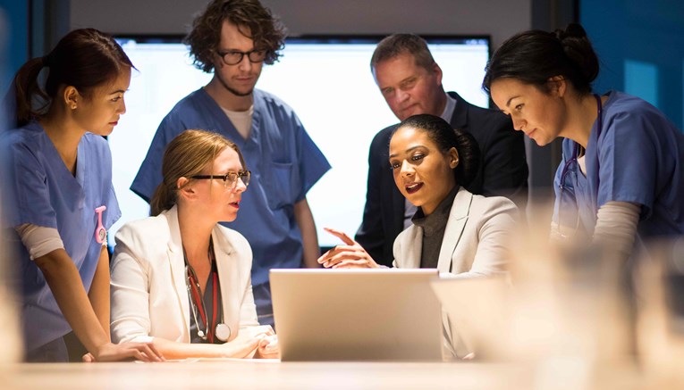 Diverse team around the table in an office environment having a meeting