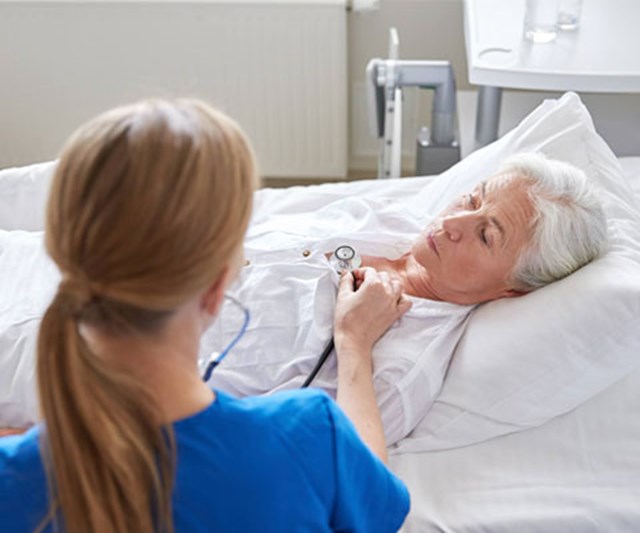 Old lady on hospital bed